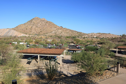 Phoenix, AZ - October 21, 2023: Packed parking lot at entrance to family-friendly Phoenix Mountain Preserve also known as Dreamy Draw desert recreation area located north of city downtown