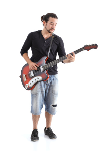 Boy playing bass isolated on a white background