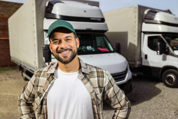 istock Happy confident male driver standing in front on his truck 1756241724