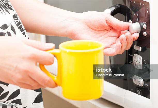 Setting A Timer On The Microwave Oven Stock Photo - Download Image Now - Microwave, Mug, Beginnings