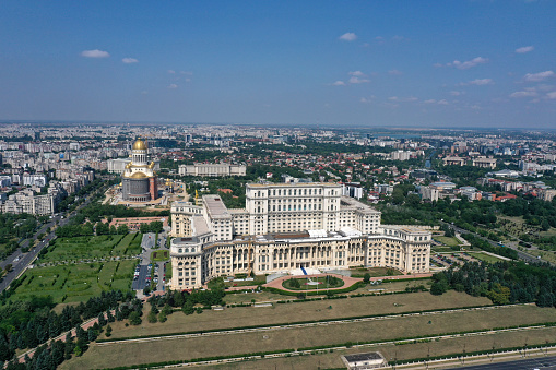 The Palace of the Parliament is the seat of the Parliament of Romania. The Palace of the Parliament is one of the heaviest buildings in the world, constructed over a period of 13 years (1984–1997). The image was captured during summer season.