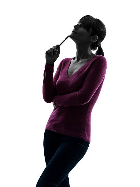 istock woman thinking looking up portrait silhouette 175625418