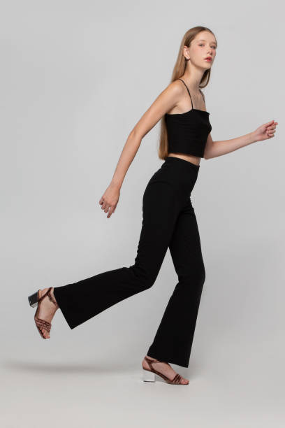 istock Beautiful slim young girl shows running movement. 1756257301