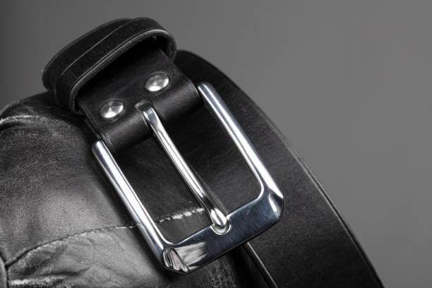 istock Part of a black crocodile leather belt. Expensive leather goods. 1756257331
