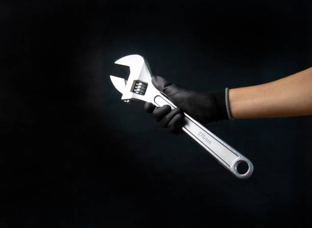 istock Mechanic holding a large adjustable wrench Size 375 mm 1756261711