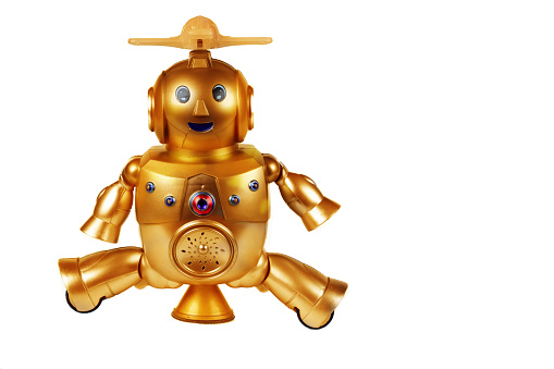 Golden toy robot isolated on white background. Dear vintage robot. Robotics.