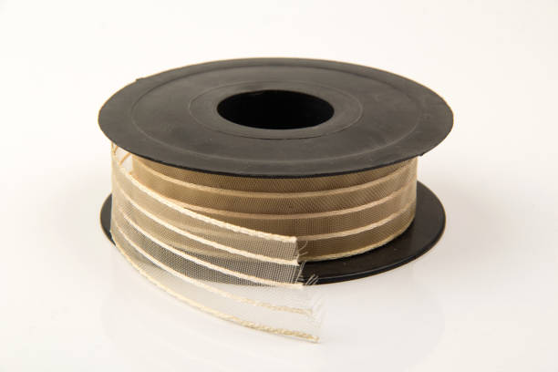istock Large spool of  ribbon on white background 1756284347