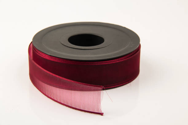 istock Large spool of  ribbon on white background 1756286578