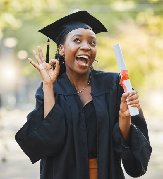 istock Graduate scroll, happy black woman and okay sign for learning success, education development or school graduation. College diploma, emoji ok icon and university student smile for perfect achievement 1756297077