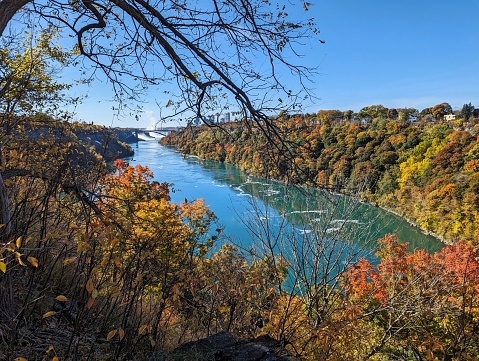 View of Niagara River Gorge from nature trail on the American side, with Niagara Falls in the far distance