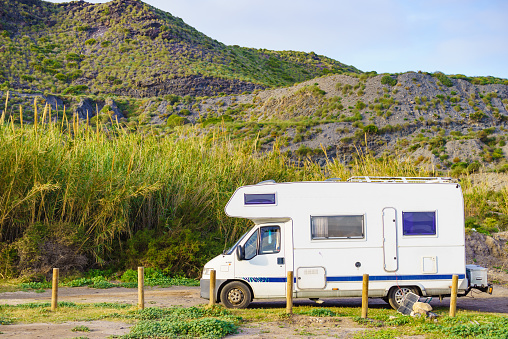 Camper car rv camping on coastal nature, Spain Murcia region, Calblanque Regional Park.
