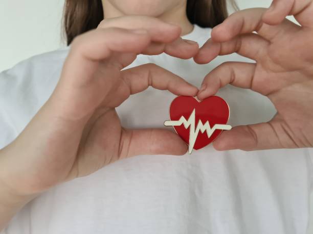 istock Child holding red heart closeup 1756316630