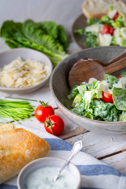 istock Green salad with tomatoes, bread and parmesan cheese 1756318324