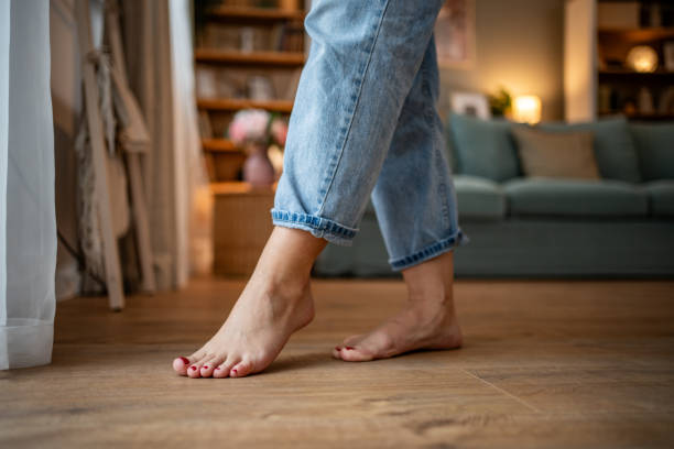 istock A young woman walks on a warm floor, barefoot 1756340830