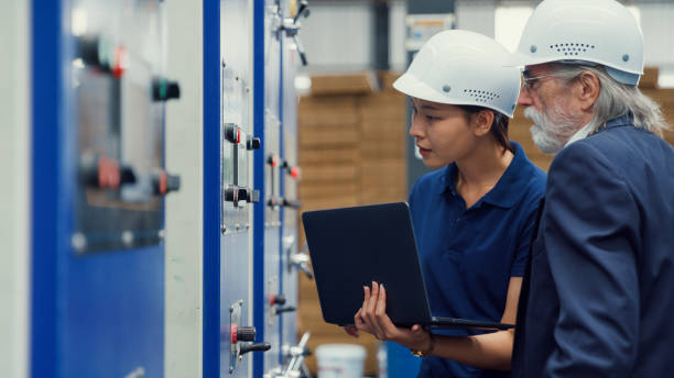 istock Professional male industrial engineers talk with factory worker while using laptop in manufacturing factory. Working in manufacturing plant or production plant. 1756343672