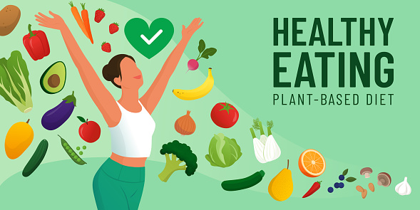Happy fit woman smiling with arms raised, she is surrounded by many vegetables and fruits: healthy diet concept