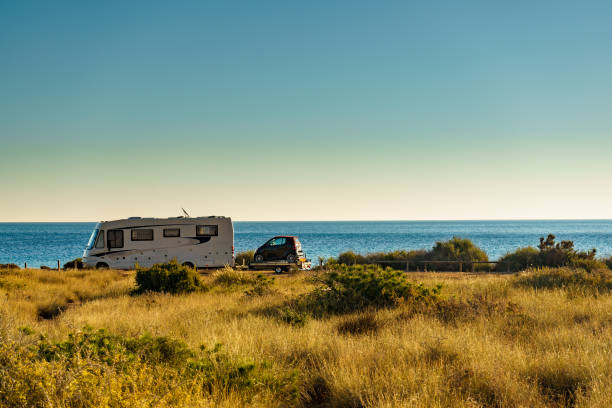 istock Camper car on beach, camping on seashore 1756352665