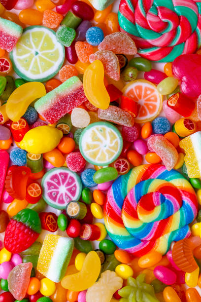 istock Colorful lollipops and different colored round candy. Top view. 1756364351