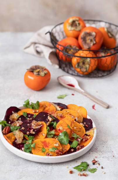 istock Winter salad of beets, persimmons, lemon and cilantro 1756372184