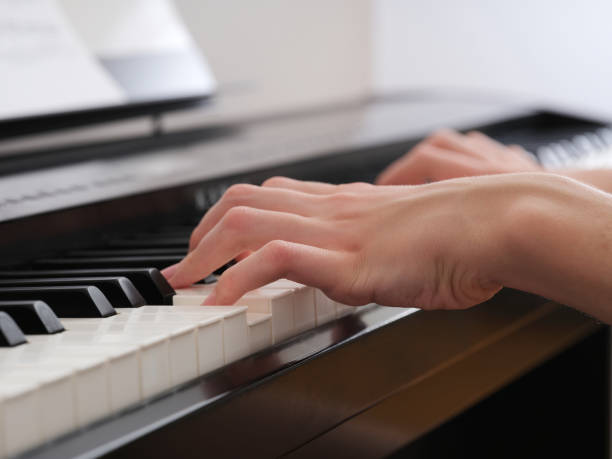istock A young man playing on a digital piano 1756375714
