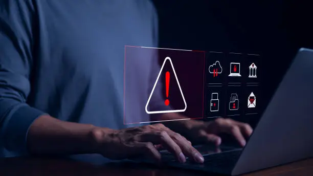 Photo of Cyber security warning alert system concept. Businessman working on laptop. Computer network hack, crime and virus, Malicious software, compromised information, illegal connection, data vulnerability,