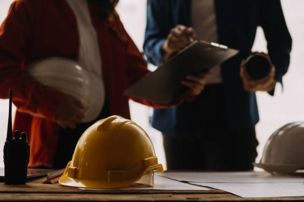 istock Construction and structure concept of engineer working drawing on blueprint meeting for project working with partner on model building and engineering tools in working site, construction concept 1756380068