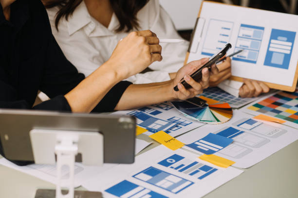 istock Close up ux developer and ui designer use augmented reality brainstorming about mobile app interface wireframe design on desk at modern office.Creative digital development agency 1756380076