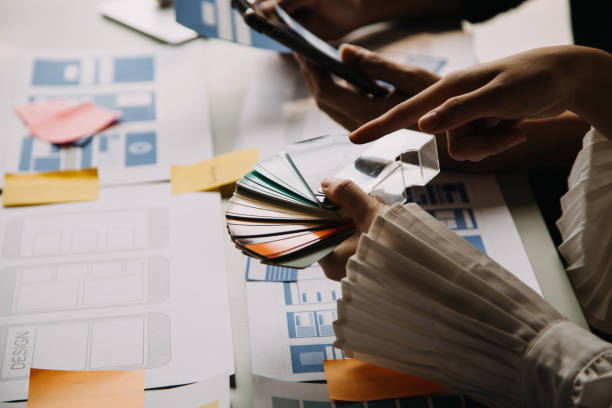 istock Close up ux developer and ui designer use augmented reality brainstorming about mobile app interface wireframe design on desk at modern office.Creative digital development agency 1756380096