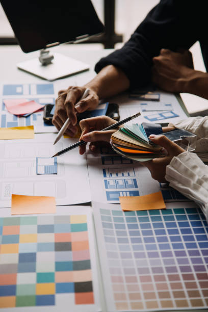 istock Close up ux developer and ui designer use augmented reality brainstorming about mobile app interface wireframe design on desk at modern office.Creative digital development agency 1756380098