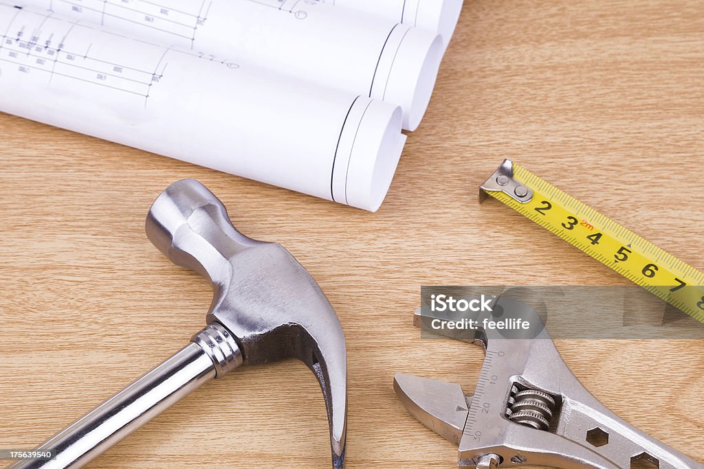construction:work tool and blueprint on wood Architect Stock Photo
