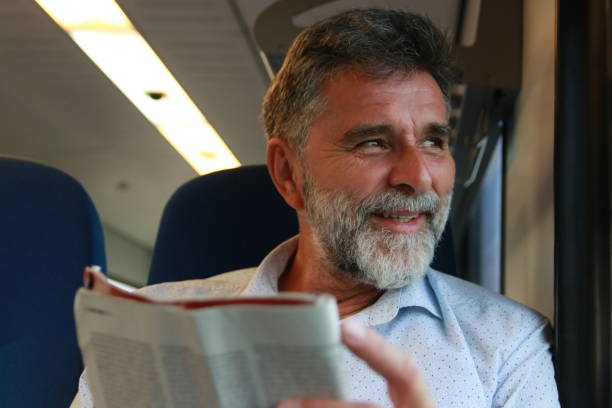 istock Mature man read newspaper in public transport 1756407342