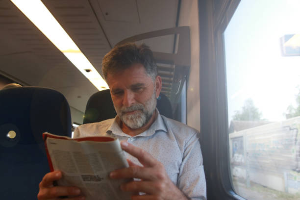 istock Mature man read newspaper in public transport 1756407350