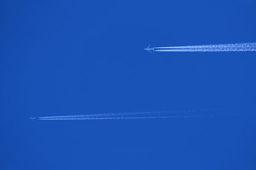 contrail in the sky from two aircraft