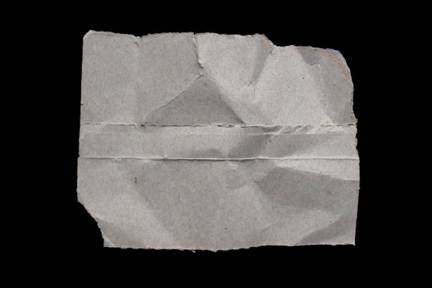 istock Ripped paper piece on isolated black background 1756410579