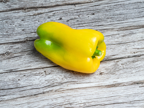 Variation of different color bell peppers on a white background. Colorful paprikas viewed from above isolated on white. Top view