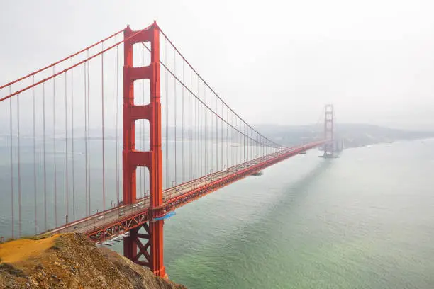 Photo of Golden Gate Bridge, the symbol of San Francisco city on a foggy day - California - USA