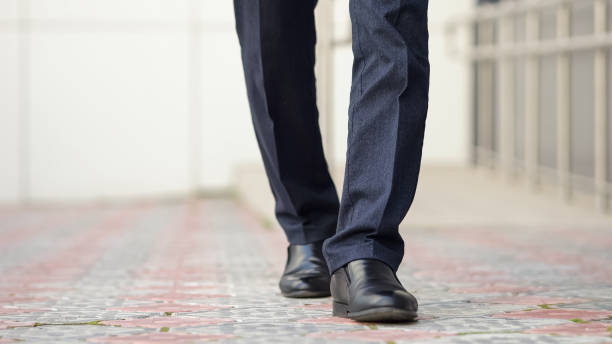 istock Businessman wears costume while walks outdoors 1756418682
