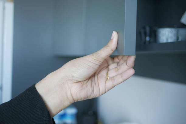 istock women hand open a kitchen cabinet drawer 1756421532