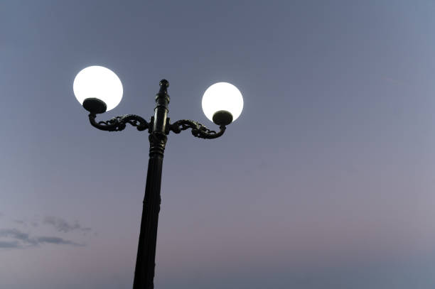 istock Double-armed lantern in front of the evening sky 1756431701