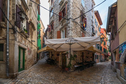 Rovinj, Croatia - October 8, 2023: A low angle view of the town residential architecture with laundry. Rovinj is a popular tourist destination on the Adriatic coast in Croatia.