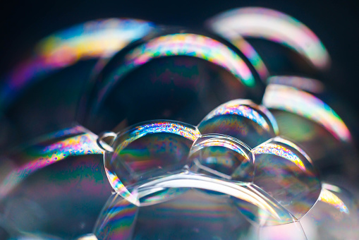 macro images of soap bubbles with colorful textures and reflections