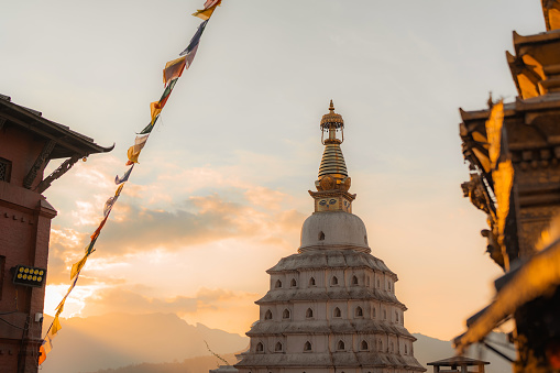 Monkey temple and white stupa in  Kathmandu at sunset