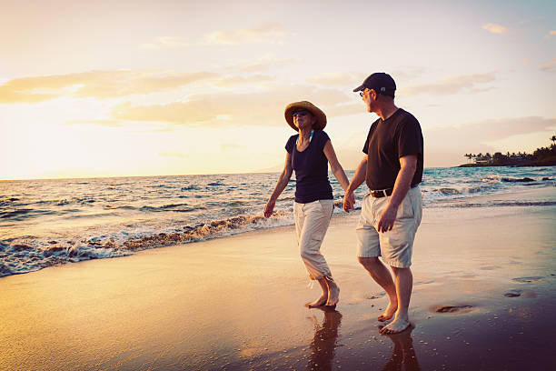 istock Senior Couple Enjoying Sunset at the Beach 175647367