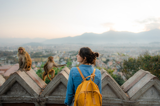 Female tourist exploring  monkey temple  in Kathmandu