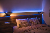 Cozy bedroom under blue neon light