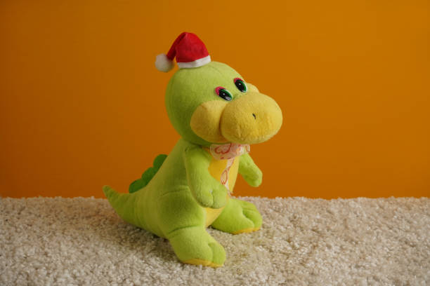 istock Green plush dragon wearing a Santa Claus hat. 1756482207