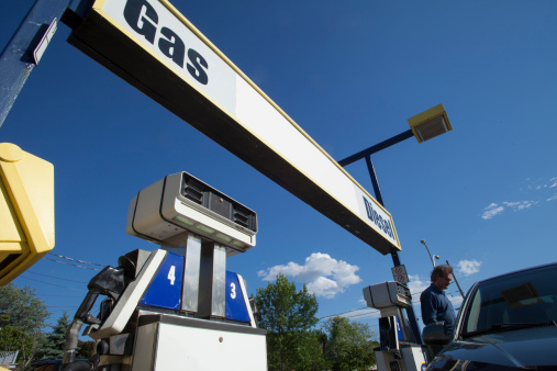 men fueling up his car