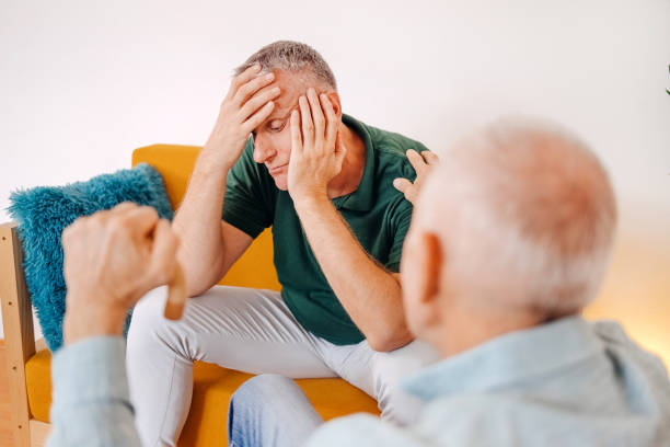 istock Old man giving support to his sad and disappointed middle age son at home 1756485065