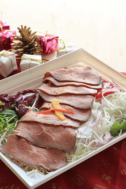 sliced roast beef and christmas ornament