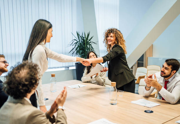 istock Businesswomen shaking hands after a successful meeting 1756493773